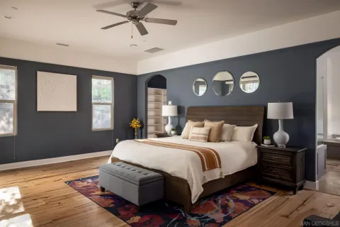 a bedroom with bed and window