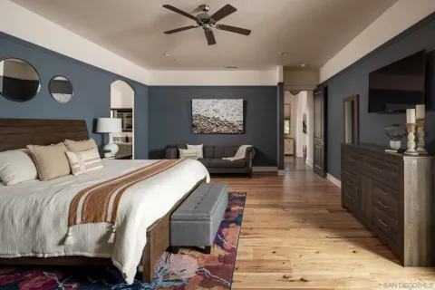 a bed room with a bed and a television