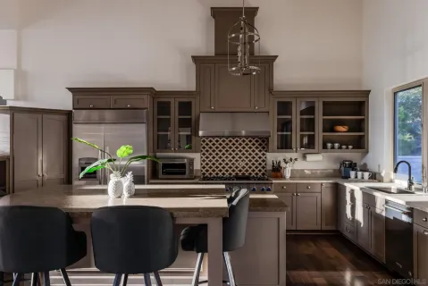 a kitchen with a sink cabinets and window
