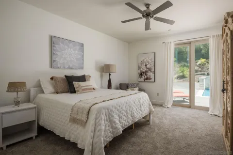 a bedroom with bed and window