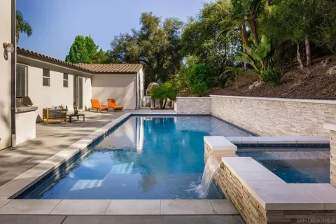 a view of a patio with table and chairs