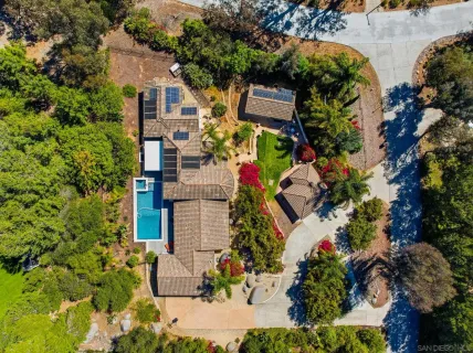 an aerial view of houses with yard
