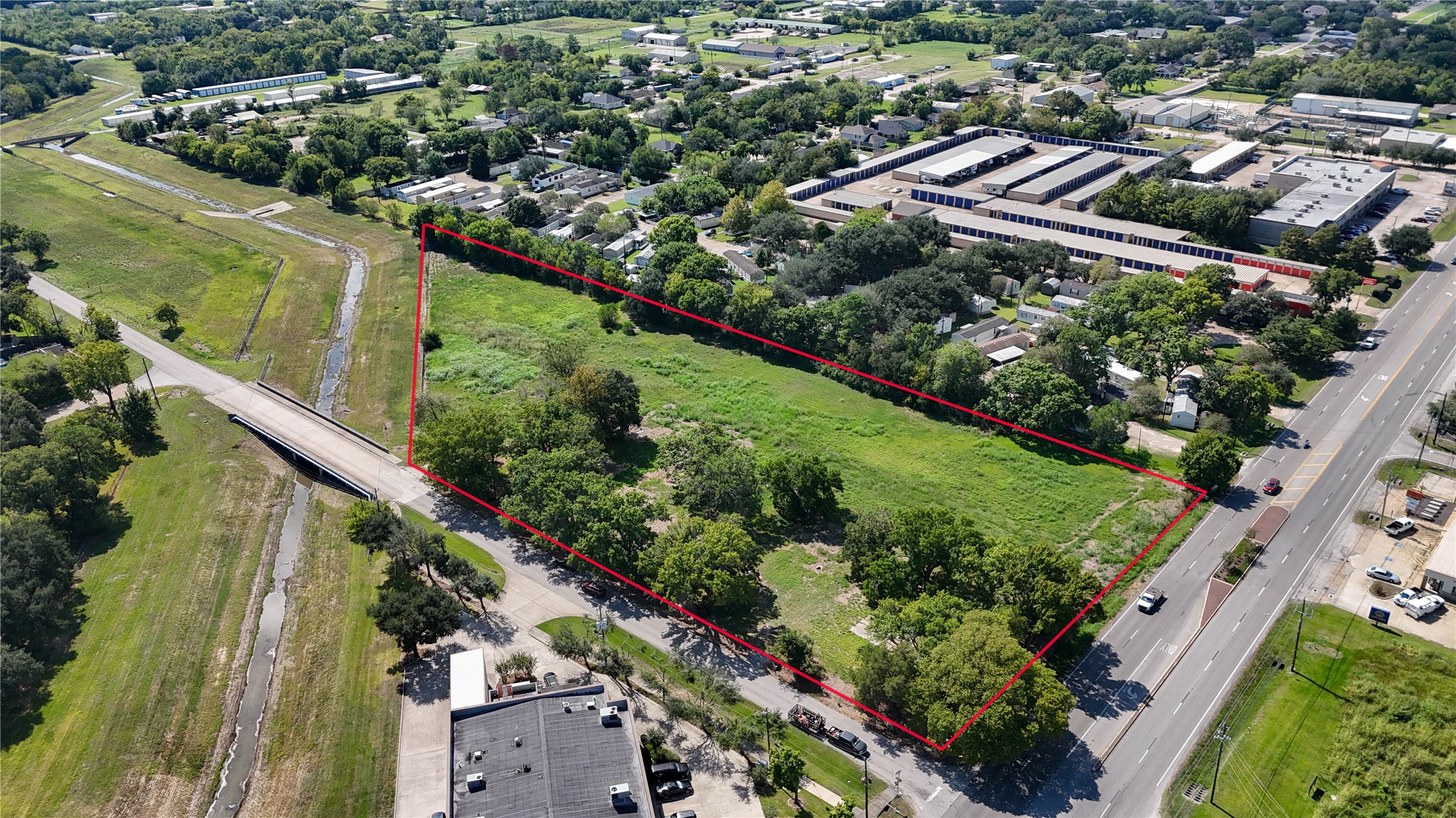 5604 Broadway Street Pearland, TX 77581 - Photo 8 of 8 an aerial view of residential houses with outdoor space and street view