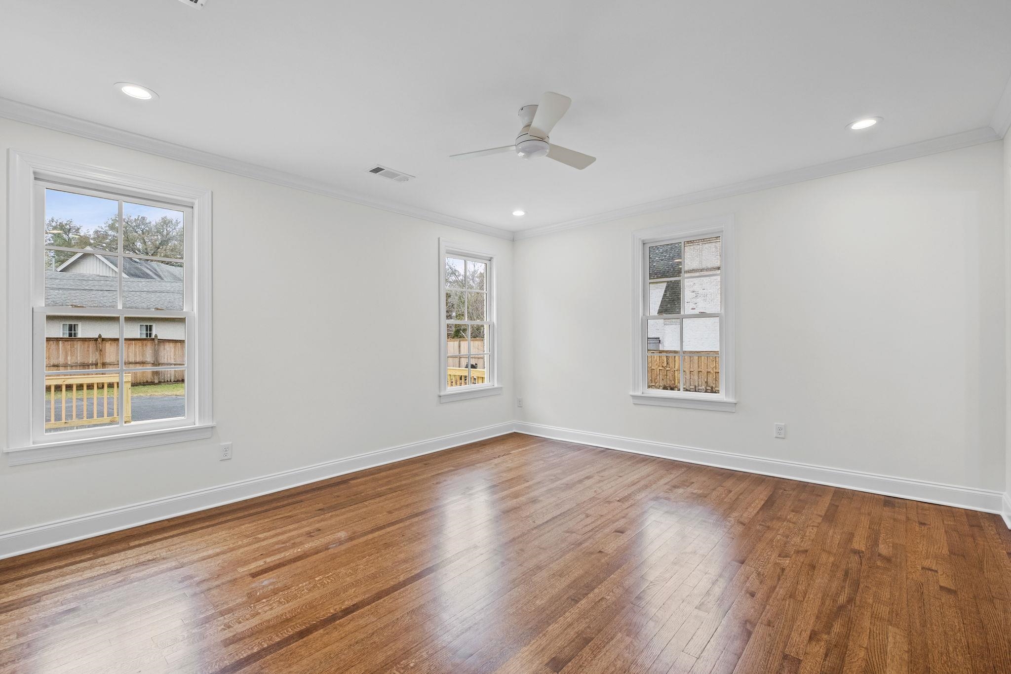 59 Devon Way Memphis, TN 38111 - Photo 25 of 40 a view of an empty room with wooden floor and a window