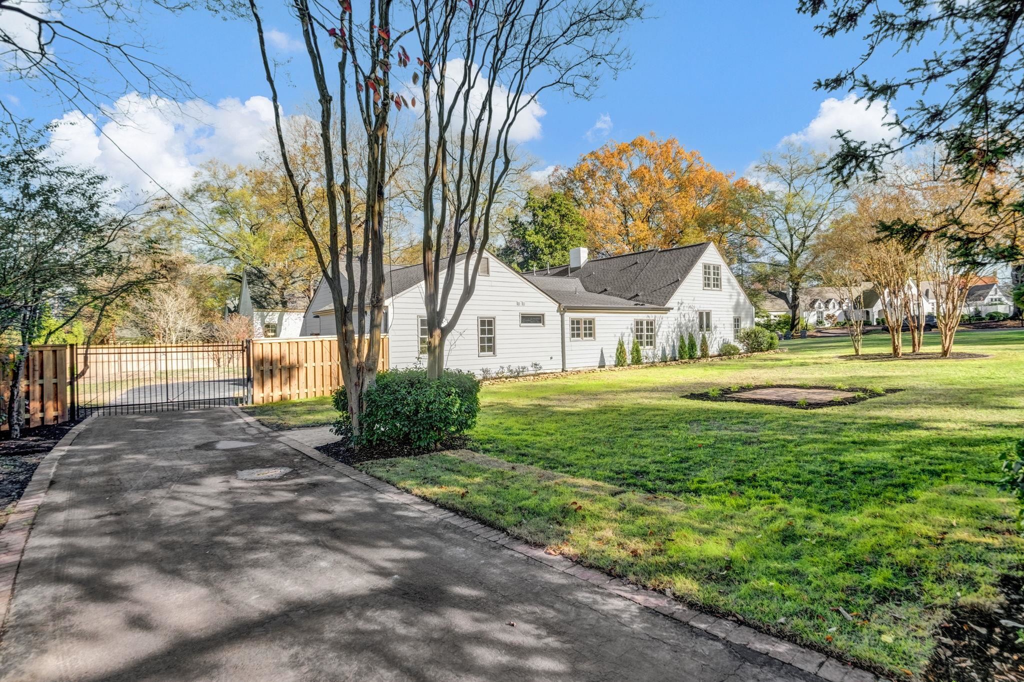 59 Devon Way Memphis, TN 38111 - Photo 36 of 40 a house with huge green field in front of it