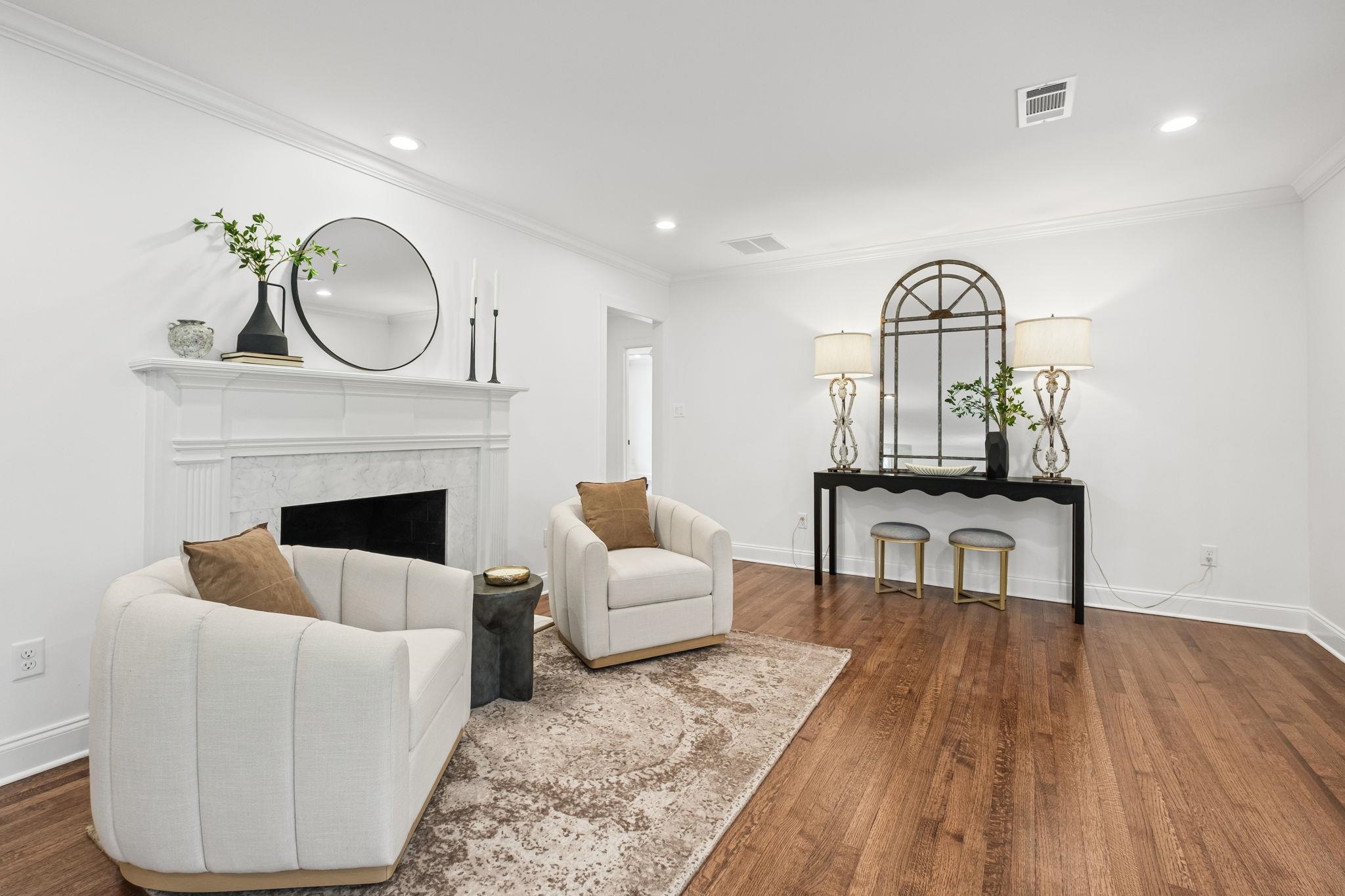 59 Devon Way Memphis, TN 38111 - Photo 4 of 40 a living room with furniture a mirror and a fireplace