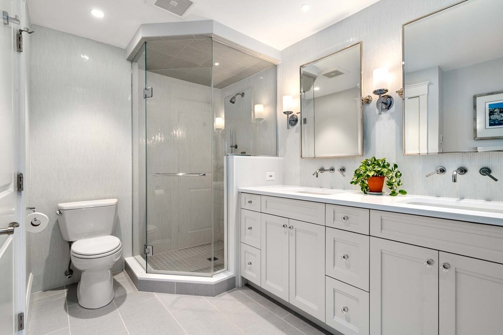 29 Royce Road Newton, MA 02459 - Photo 21 of 38 a bathroom with a shower sink vanity and toilet