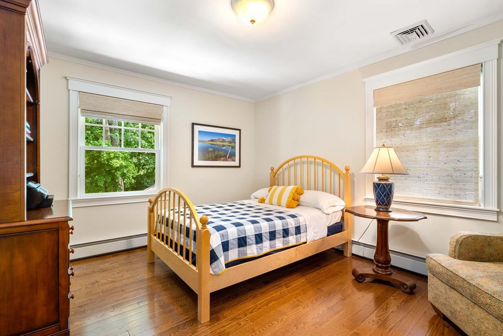 29 Royce Road Newton, MA 02459 - Photo 22 of 38 a bedroom with a bed and a window
