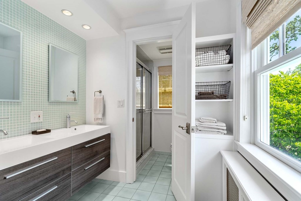 29 Royce Road Newton, MA 02459 - Photo 24 of 38 a bathroom with a sink and a mirror