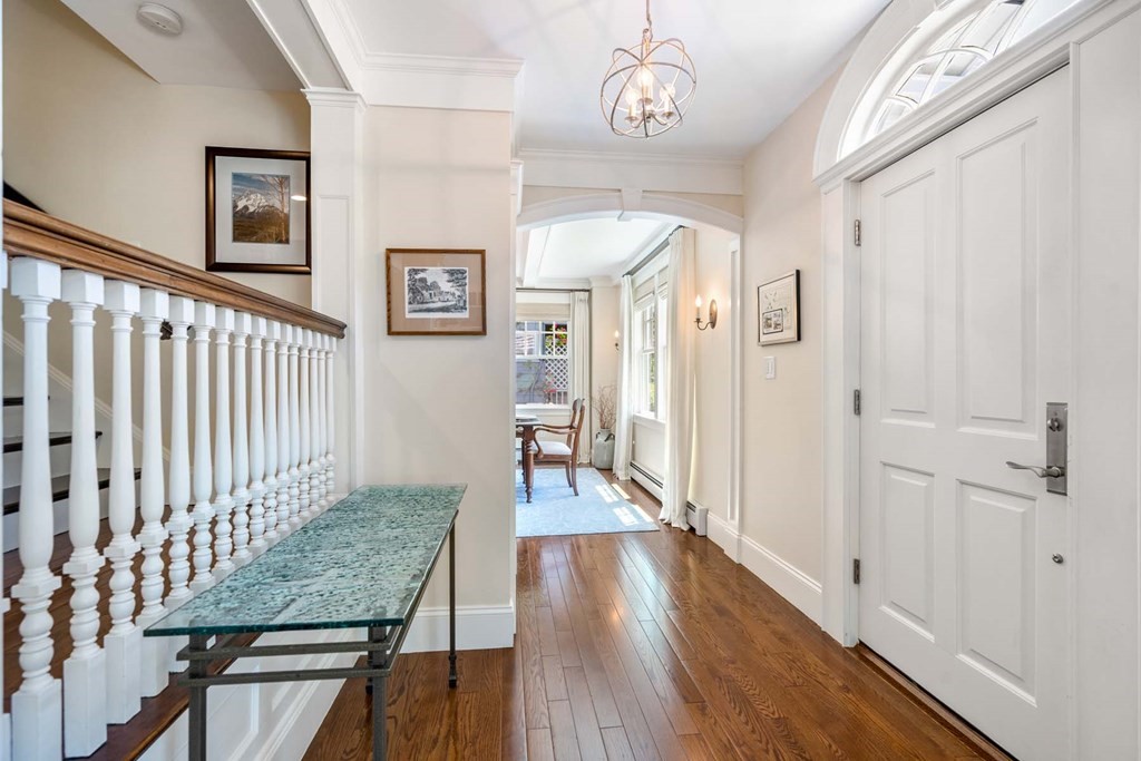 29 Royce Road Newton, MA 02459 - Photo 3 of 38 a view of a hallway with wooden floor and staircase
