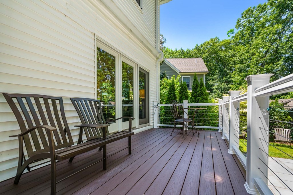 29 Royce Road Newton, MA 02459 - Photo 33 of 38 a balcony with wooden floor table and chairs