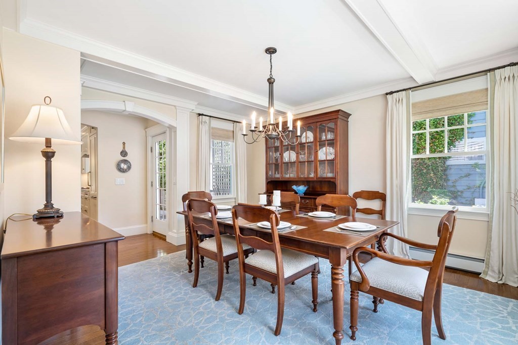 29 Royce Road Newton, MA 02459 - Photo 9 of 38 a dining room with furniture a chandelier and wooden floor