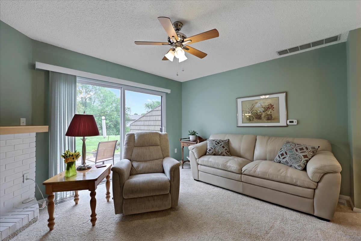 2004 Blackthorn Drive Champaign, IL 61821 - Photo 13 of 24 a living room with furniture and a large window