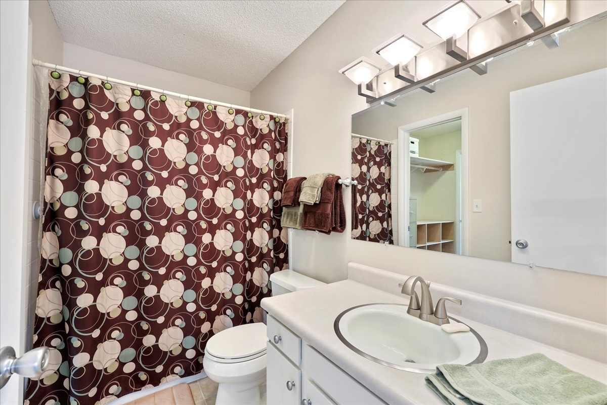 2004 Blackthorn Drive Champaign, IL 61821 - Photo 20 of 24 a bathroom with a granite countertop sink and a mirror