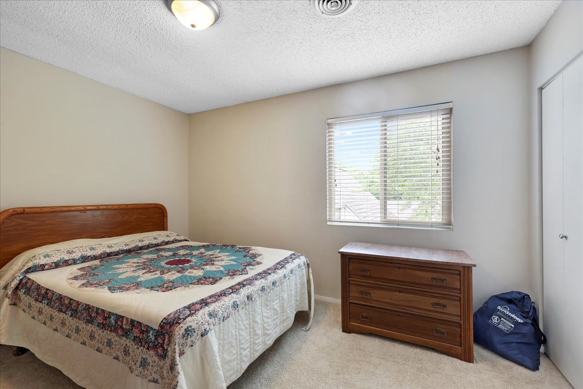 2004 Blackthorn Drive Champaign, IL 61821 - Photo 21 of 24 a bedroom with a bed and a window