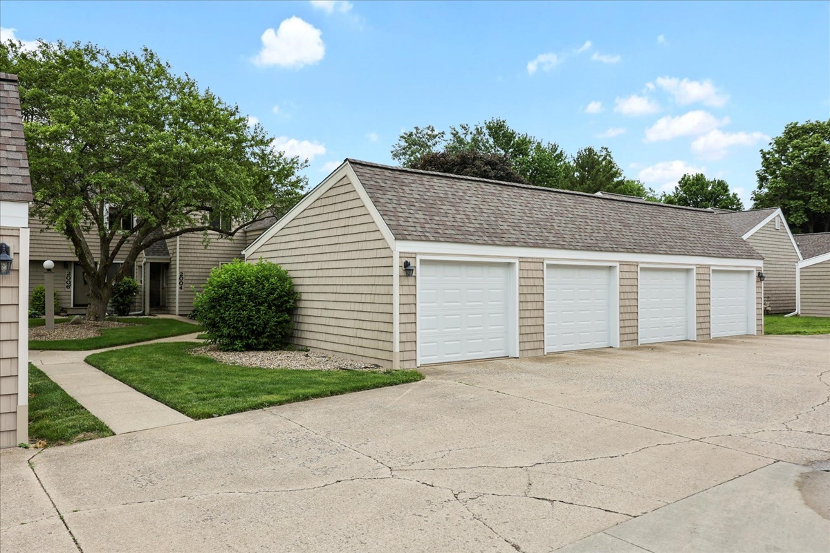 2004 Blackthorn Drive Champaign, IL 61821 - Photo 3 of 24 a view of a house with a yard and potted plants