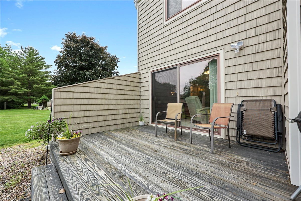 2004 Blackthorn Drive Champaign, IL 61821 - Photo 5 of 24 a view of a patio with a table and chairs and potted plants