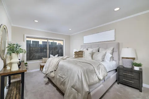 a bed room with a bed and a window