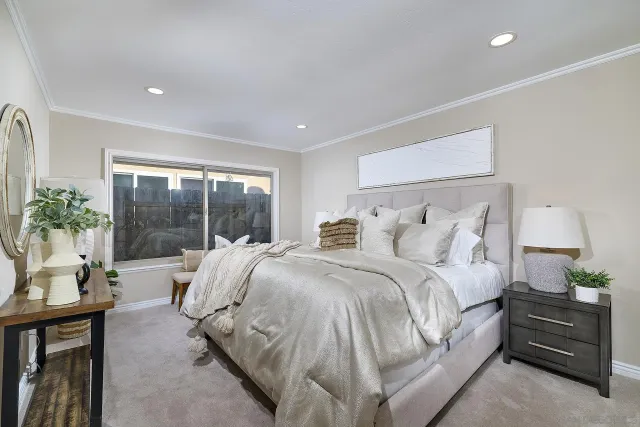 a bed room with a bed and a window