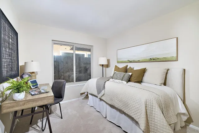 a bed room with a bed and a chair