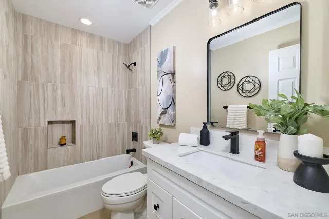 a bathroom with a toilet a sink and a bathtub