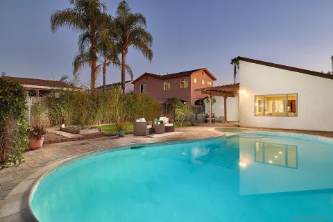 a view of a house with a swimming pool