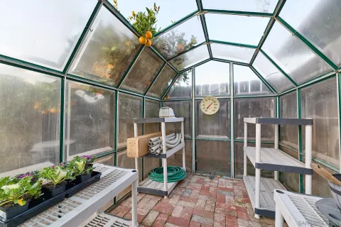 a view of entryway with a flower garden