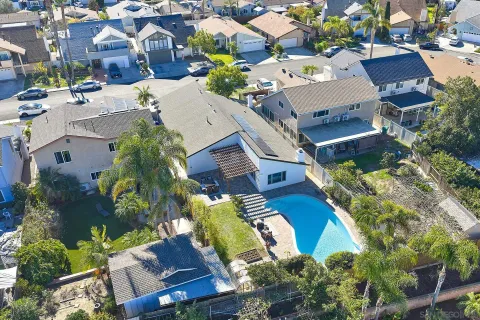an aerial view of residential houses with outdoor space