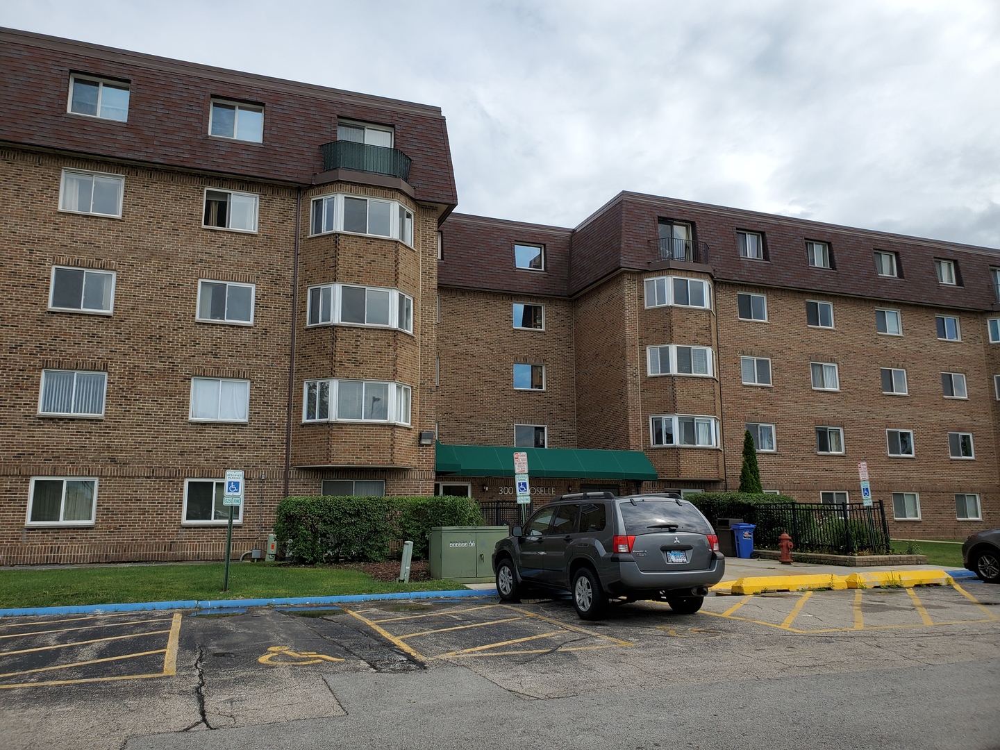 a car parked in front of a brick building
