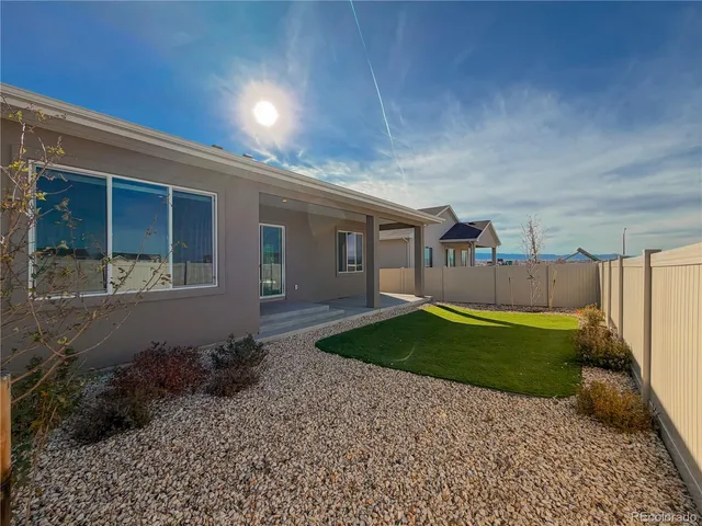 a house view with a backyard space
