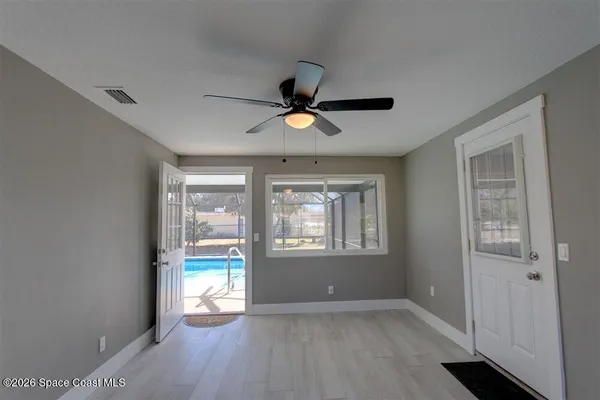 a view of an empty room with a window