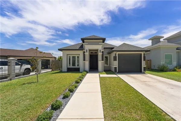 front view of a house with a yard