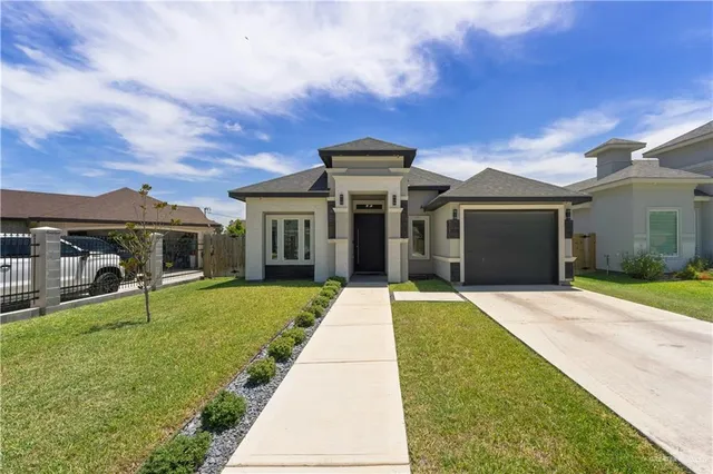 front view of a house with a yard