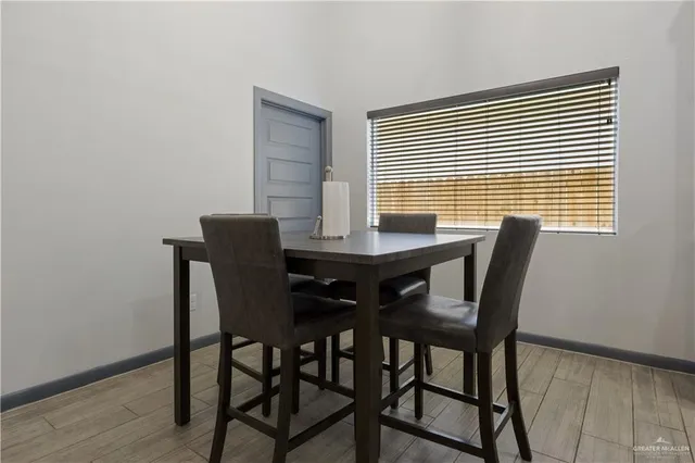 a view of a dining room with furniture and wooden floor
