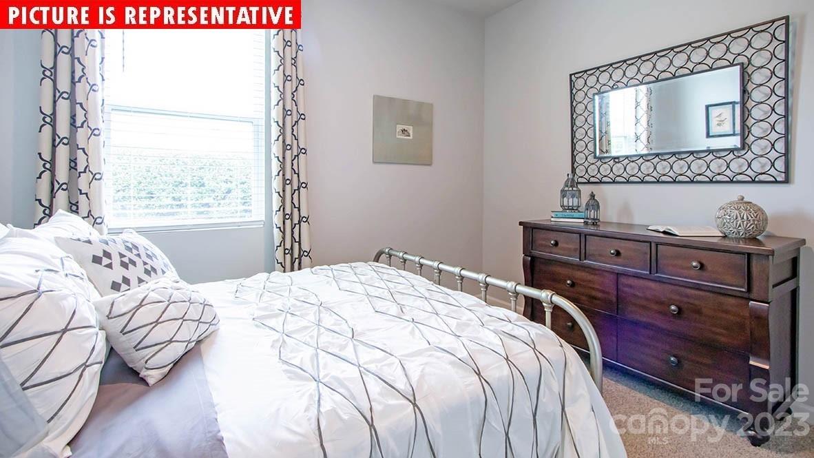 2147 Vanderlyn Street Monroe, NC 28112 - Photo 15 of 22 a bedroom with a bed and a window