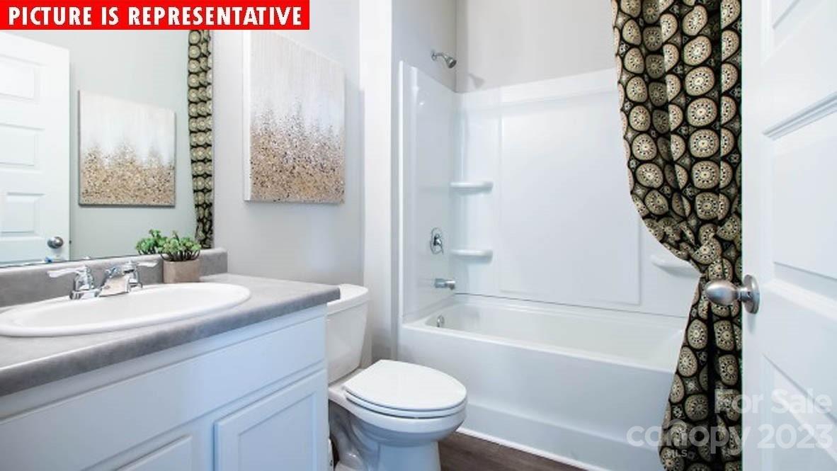 2147 Vanderlyn Street Monroe, NC 28112 - Photo 17 of 22 a bathroom with a sink a toilet and shower