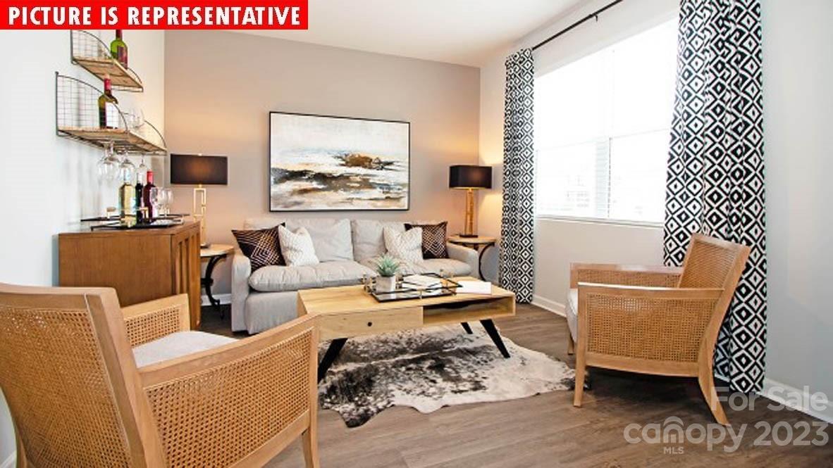 2147 Vanderlyn Street Monroe, NC 28112 - Photo 4 of 22 a living room with furniture and a wooden floor