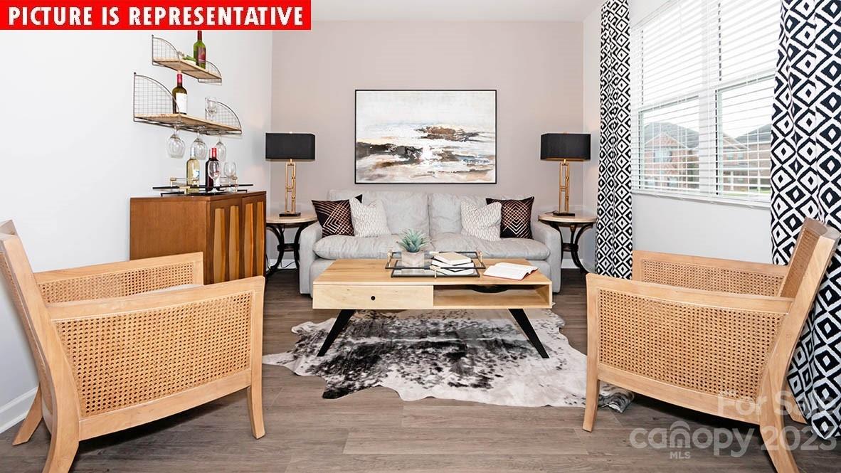 2147 Vanderlyn Street Monroe, NC 28112 - Photo 5 of 22 a living room with furniture and a table