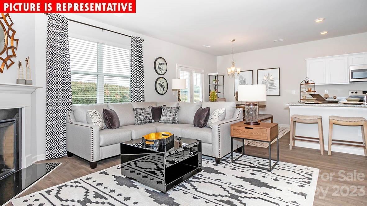 2147 Vanderlyn Street Monroe, NC 28112 - Photo 9 of 22 a living room with furniture and a fireplace