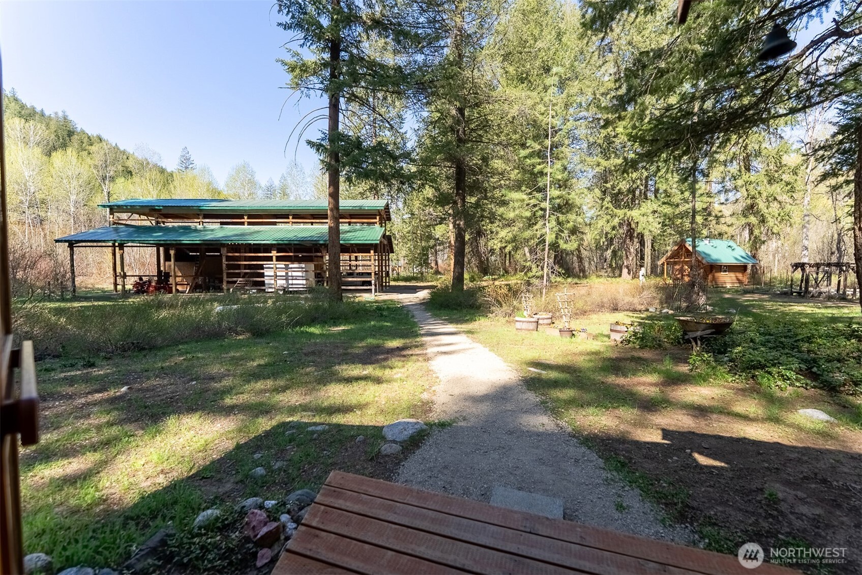 583 B Twisp River Road Twisp, WA 98856 - Photo 31 of 39 a view of backyard with swimming pool and seating space