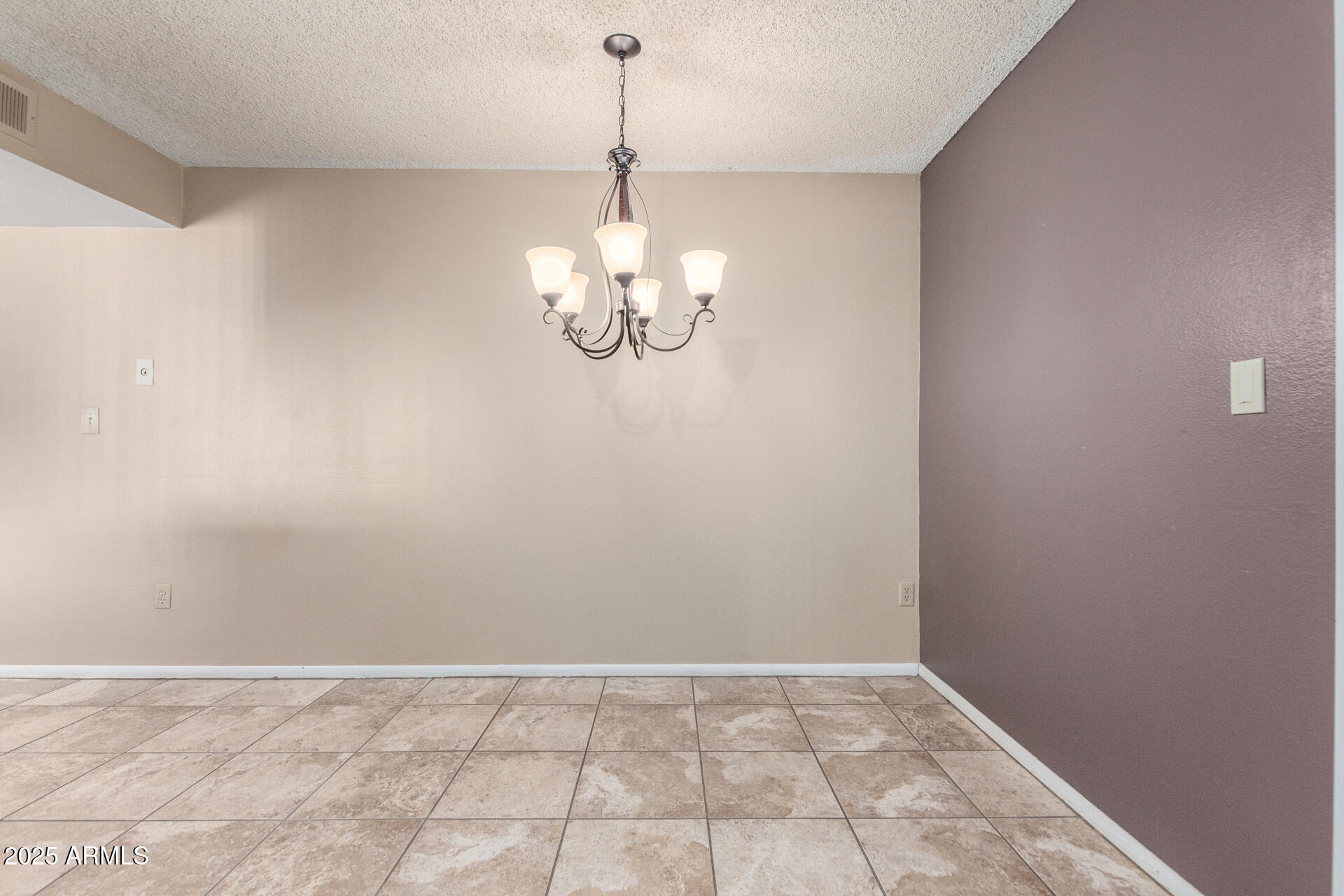 4740 West Bloomfield Road Glendale, AZ 85304 - Photo 7 of 34 a view of a chandelier in big room