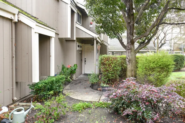 a front view of a house with garden