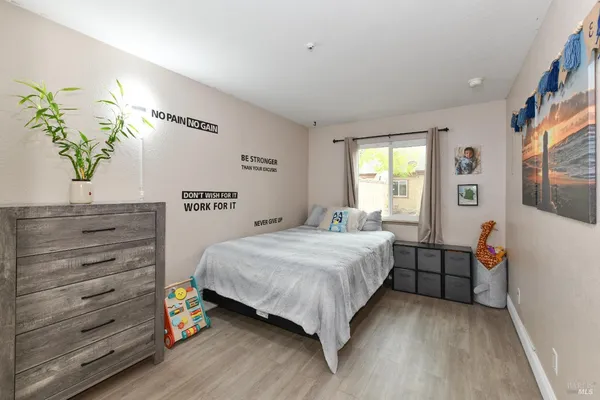 a bedroom with a bed and a dresser