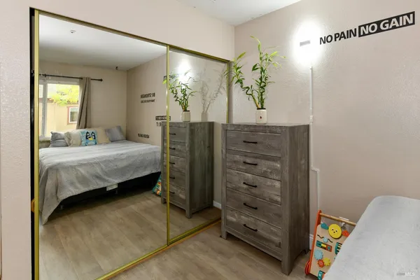 a bathroom with a sink vanity mirror and toilet