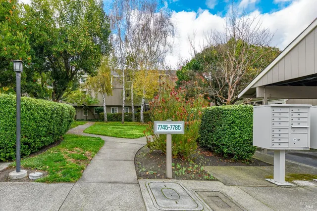 front view of a building with a garden