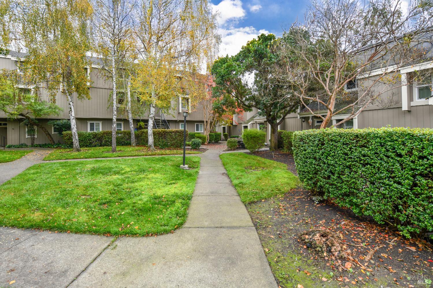 7755 Camino Colegio Rohnert Park, CA 94928 - Photo 5 of 26 front view of a building with a garden