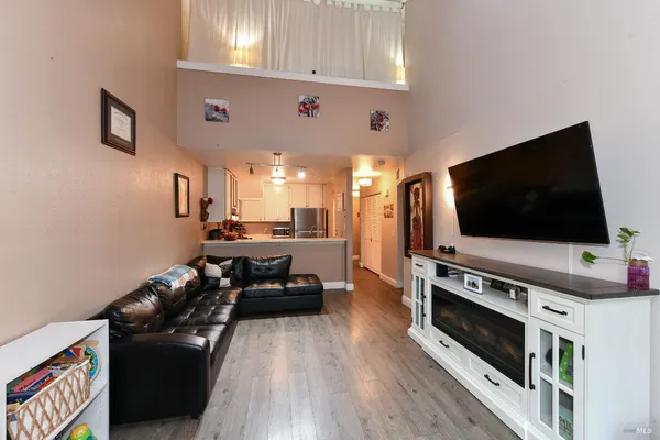 a kitchen with kitchen island granite countertop a sink stainless steel appliances and cabinets