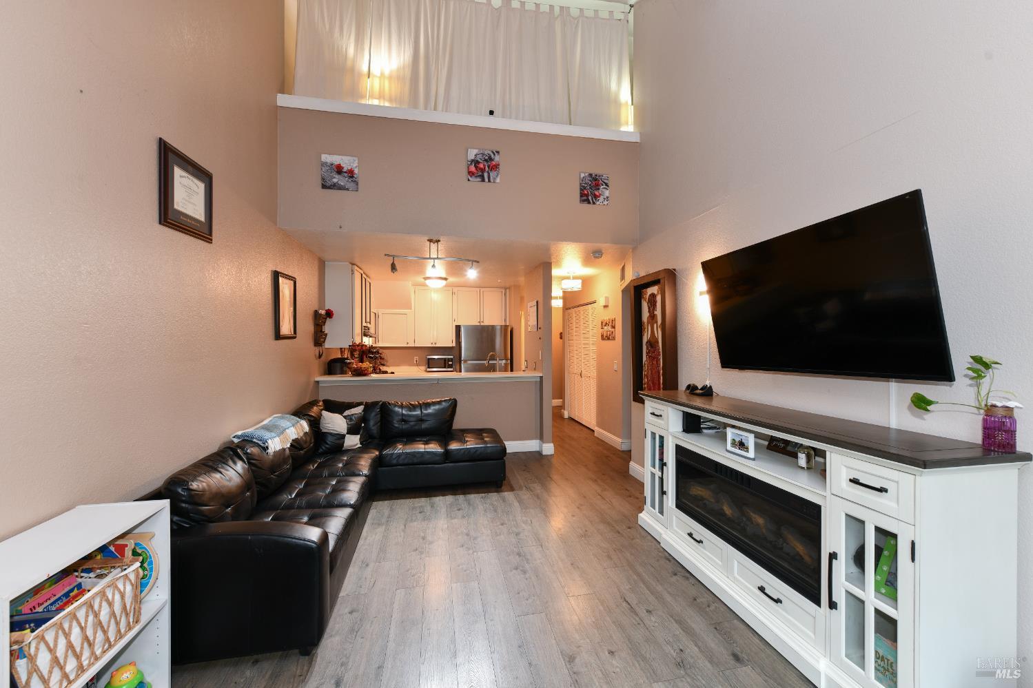 7755 Camino Colegio Rohnert Park, CA 94928 - Photo 8 of 26 a living room with furniture and a flat screen tv