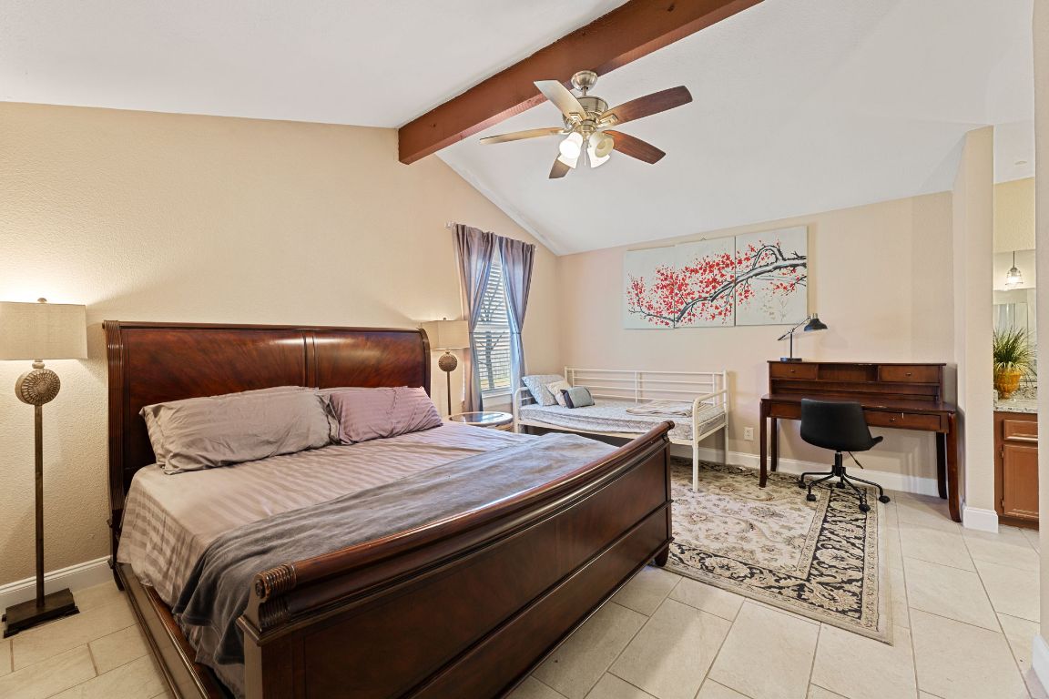 1602 Plateau Ridge Cedar Park, TX 78613 - Photo 11 of 29 a bedroom with a bed and a chandelier