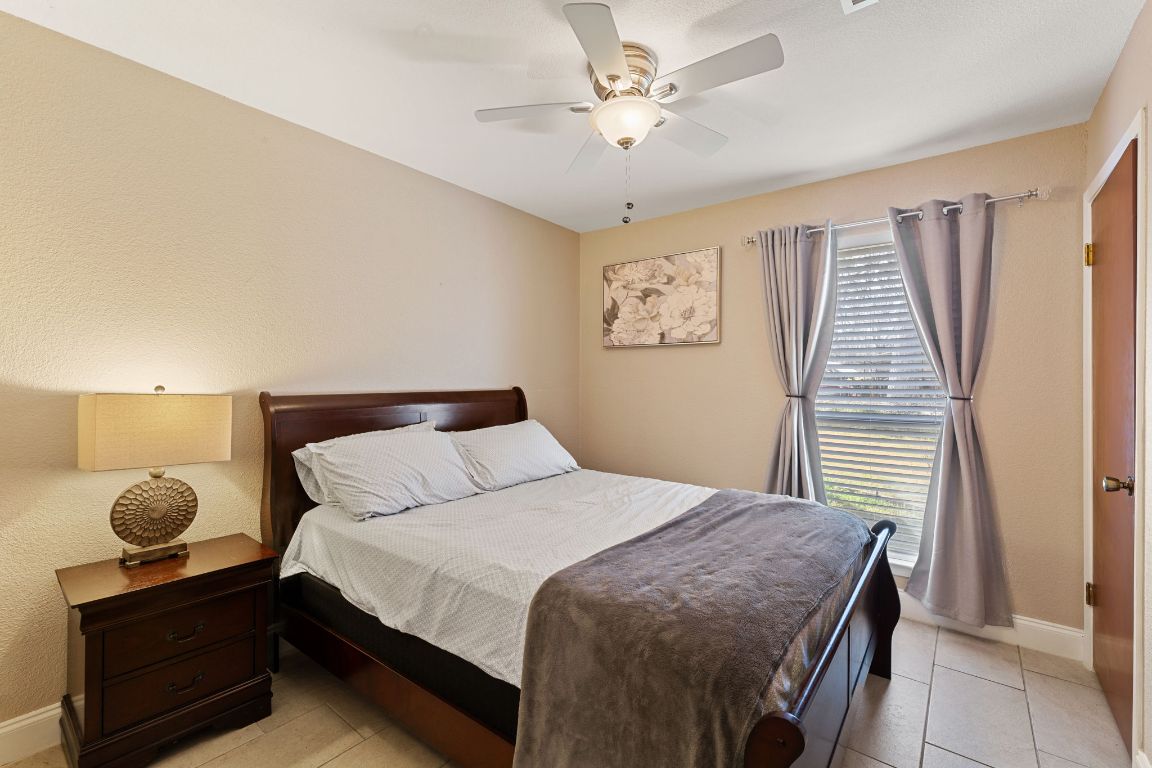 1602 Plateau Ridge Cedar Park, TX 78613 - Photo 19 of 29 a bedroom with a bed and a window